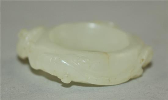 A Chinese white jade archers thumb ring, 18th / 19th century, 3cm